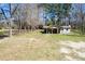 Aerial view of a single-story house with a front porch and a well-maintained lawn and wooded surroundings at 328 Fox Field Rd, Walterboro, SC 29488