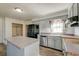 A bright kitchen with a center island and view of the sink and dishwasher at 328 Fox Field Rd, Walterboro, SC 29488