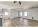 Living room and kitchen area featuring hard surface flooring, white trim, lots of natural light and neutral colors at 328 Fox Field Rd, Walterboro, SC 29488