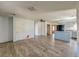 Spacious living room connected to the kitchen area, featuring hard surface flooring and a ceiling fan at 328 Fox Field Rd, Walterboro, SC 29488