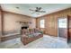 Inviting living room featuring a brick fireplace, wood paneling and access to the outdoors at 328 Fox Field Rd, Walterboro, SC 29488