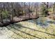 Scenic backyard pond with wooden bridge, providing a tranquil outdoor escape at 328 Fox Field Rd, Walterboro, SC 29488