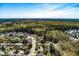 Expansive aerial view of a suburban neighborhood surrounded by lush greenery and trees at 329 Carriage Wheel Rd, Moncks Corner, SC 29461