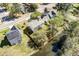 Aerial view of a well-maintained home with backyard bordering a tranquil waterway, surrounded by lush greenery at 329 Carriage Wheel Rd, Moncks Corner, SC 29461