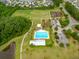 Aerial view of community amenities including a pool, playground, sports fields, and green spaces at 329 Carriage Wheel Rd, Moncks Corner, SC 29461