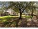 Back yard features a well-maintained lawn, a storage shed, and a privacy fence at 329 Carriage Wheel Rd, Moncks Corner, SC 29461