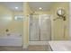 Bathroom featuring a jacuzzi tub, tiled floor, and a shower behind glass at 329 Carriage Wheel Rd, Moncks Corner, SC 29461