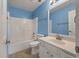 Bright bathroom with shower over tub combination, tiled floor, and new fixtures at 329 Carriage Wheel Rd, Moncks Corner, SC 29461