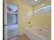 Bathroom featuring a large soaking tub and a view into an adjacent bedroom at 329 Carriage Wheel Rd, Moncks Corner, SC 29461