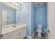 Bathroom with vanity sink, and tile floors is painted in a light blue at 329 Carriage Wheel Rd, Moncks Corner, SC 29461