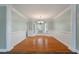 Bright dining room with hardwood floors and lots of windows overlooking a yard at 329 Carriage Wheel Rd, Moncks Corner, SC 29461