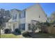 Well-maintained two-story home exhibiting vinyl siding, a manicured lawn, and bright blue shutters at 329 Carriage Wheel Rd, Moncks Corner, SC 29461
