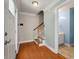 Inviting foyer featuring hardwood floors, a staircase, and access to a half bathroom at 329 Carriage Wheel Rd, Moncks Corner, SC 29461