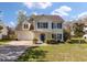 Beautiful home boasts an attached garage, front yard, and blue shutters at 329 Carriage Wheel Rd, Moncks Corner, SC 29461