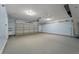 Spacious two car garage features an automatic door and ceiling fan at 329 Carriage Wheel Rd, Moncks Corner, SC 29461