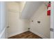 Functional laundry room with tiled floors, laundry hookups, and a fire extinguisher for added safety at 329 Carriage Wheel Rd, Moncks Corner, SC 29461