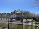 Playground with climbing structure and slide within a fenced-in area for enjoyment at 329 Carriage Wheel Rd, Moncks Corner, SC 29461