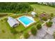 Aerial view of community pool area and nearby playground and sports fields at 329 Carriage Wheel Rd, Moncks Corner, SC 29461