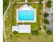 Aerial view of community pool with lounge chairs, a covered picnic area, and landscaped green space at 329 Carriage Wheel Rd, Moncks Corner, SC 29461