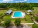 Aerial view of a community pool, perfect for hot summer days, with adjacent picnic pavilion at 329 Carriage Wheel Rd, Moncks Corner, SC 29461