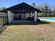 Pool pavilion with seating, a covered area, and black fencing for community members to relax at 329 Carriage Wheel Rd, Moncks Corner, SC 29461