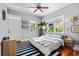 Bright, cozy bedroom with hardwood floors, ceiling fan, and natural light at 382 Race St # A, Charleston, SC 29403
