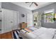 Bedroom featuring hardwood floors, stylish decor, and access to the porch at 382 Race St # A, Charleston, SC 29403
