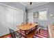 Bright dining room with a wooden table, complementing bench, and a large closet at 382 Race St # A, Charleston, SC 29403