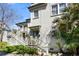 Exterior view of home showcasing a side entrance, landscaped yard, and outdoor staircases to upper level access at 382 Race St # A, Charleston, SC 29403