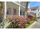 Beautiful two-story home with a porch, and lush landscaping featuring vibrant bushes, adding charm and curb appeal at 382 Race St # A, Charleston, SC 29403