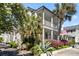 Beautiful two-story home with double porches, mature trees, and attractive landscaping, offering curb appeal and charm at 382 Race St # A, Charleston, SC 29403