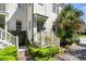 Inviting home exterior featuring landscaped greenery, a quaint porch, and meticulous details at 382 Race St # A, Charleston, SC 29403