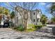 Charming home showcasing its exterior with a well-manicured lawn and a mature shade tree at 382 Race St # A, Charleston, SC 29403