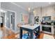 Stylish kitchen with island seating, stainless appliances, light-colored cabinets, and an open layout to the living area at 382 Race St # A, Charleston, SC 29403