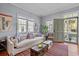 Inviting living room with a comfortable sofa, vintage trunks, and charming decor at 382 Race St # A, Charleston, SC 29403