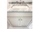 Close-up of a white bathroom vanity with light gray marble countertop, white sink, and silver faucet at 3889 Summerton St, Mount Pleasant, SC 29466