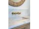 A close-up showcases the luxurious gold fixtures and marble countertop in the bathroom at 3889 Summerton St, Mount Pleasant, SC 29466