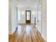 Welcoming foyer features hardwood floors, wainscoting, and a natural wood front door at 3889 Summerton St, Mount Pleasant, SC 29466