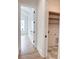 Bright hallway with hardwood floors leads to a light-filled room and the laundry area at 3889 Summerton St, Mount Pleasant, SC 29466