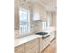 Close-up of kitchen featuring white countertops, stainless steel stovetop, and custom backsplash at 3889 Summerton St, Mount Pleasant, SC 29466