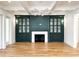 Sophisticated living room features custom built-ins, a fireplace, and coffered ceilings at 3889 Summerton St, Mount Pleasant, SC 29466