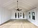 Covered porch features a wood plank ceiling with fan and multiple access doors to the house at 3889 Summerton St, Mount Pleasant, SC 29466