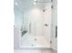 Modern bathroom with a frameless glass shower, white subway tiles, and sleek fixtures at 3889 Summerton St, Mount Pleasant, SC 29466