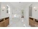 Bright bathroom features a freestanding tub, tiled shower, double vanity with marble countertops, and open doorway at 3893 Summerton St, Mount Pleasant, SC 29466