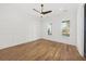 Light-filled bedroom with hardwood floors, white walls, and modern ceiling fan at 3893 Summerton St, Mount Pleasant, SC 29466