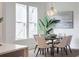 Dining room showcasing a wooden table with six chairs, a modern light fixture, and neutral decor at 3893 Summerton St, Mount Pleasant, SC 29466