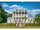 Stunning two-story home featuring double porches, landscaped yard, and a charming walkway leading to the front entrance at 3893 Summerton St, Mount Pleasant, SC 29466