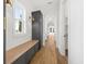 Hallway featuring hardwood floors, built in bench with storage and wainscotting at 3893 Summerton St, Mount Pleasant, SC 29466