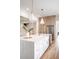 Spacious kitchen features an island with white countertops, a stainless-steel fridge, and wooden cabinetry at 3893 Summerton St, Mount Pleasant, SC 29466