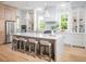 Gourmet kitchen with an oversized island, seating, pendant lights, custom cabinets, and stainless-steel appliances at 3893 Summerton St, Mount Pleasant, SC 29466